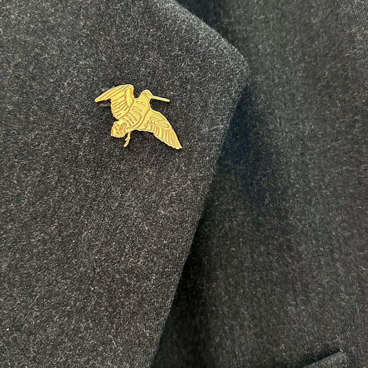 Spilla con beccaccia applicata su giacca